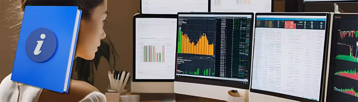 A woman sits focused on multiple computer screens displaying colorful financial charts and data and a guide icon. The scene conveys a sense of concentration and analysis.